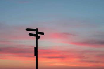 silhouette of road signage during golden hour